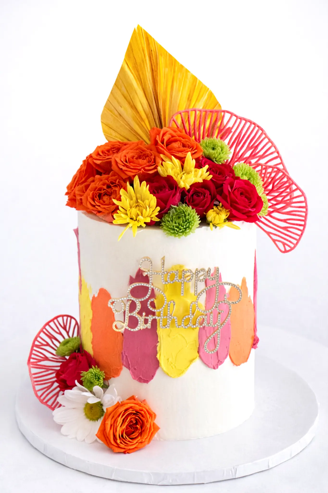 Custom cake with colorful buttercream brushstrokes, fresh orange roses and yellow flowers, Happy Birthday topper
