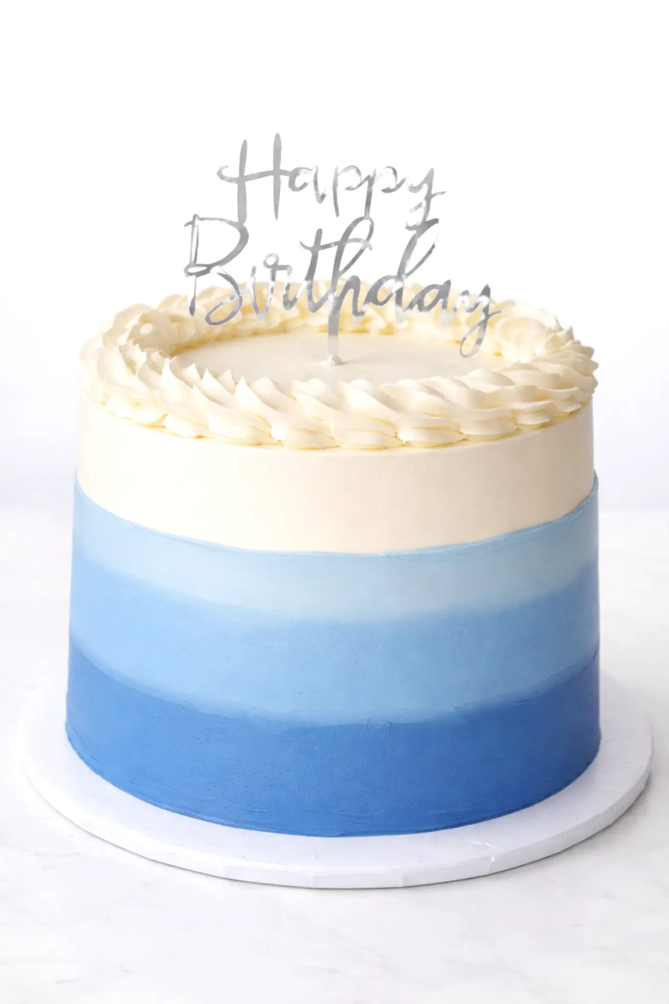 Blue ombre buttercream express birthday cake with silver Happy Birthday topper